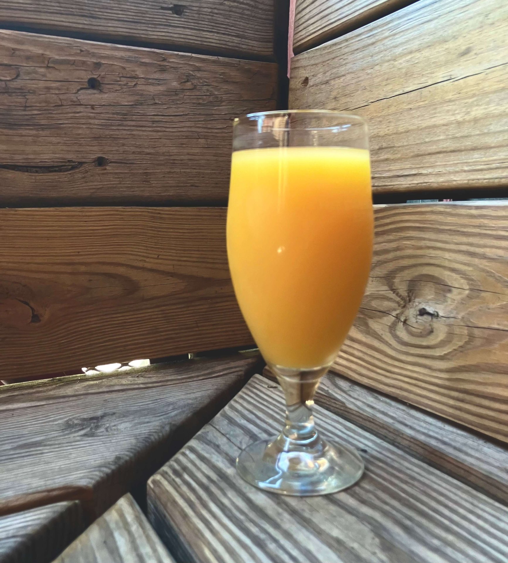 Mimosa on the wooden patio at Louise's Bar Downtown Lawrence KS